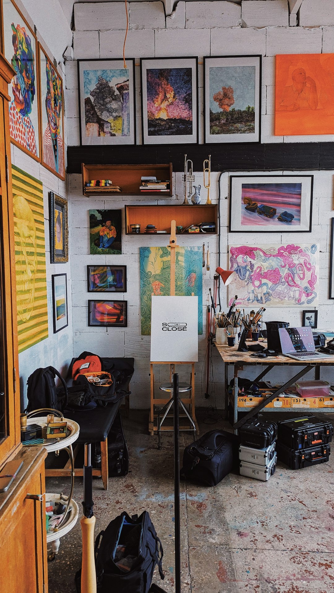 a-room-filled-with-lots-of-art-and-paintings-fuxje3dz7ey